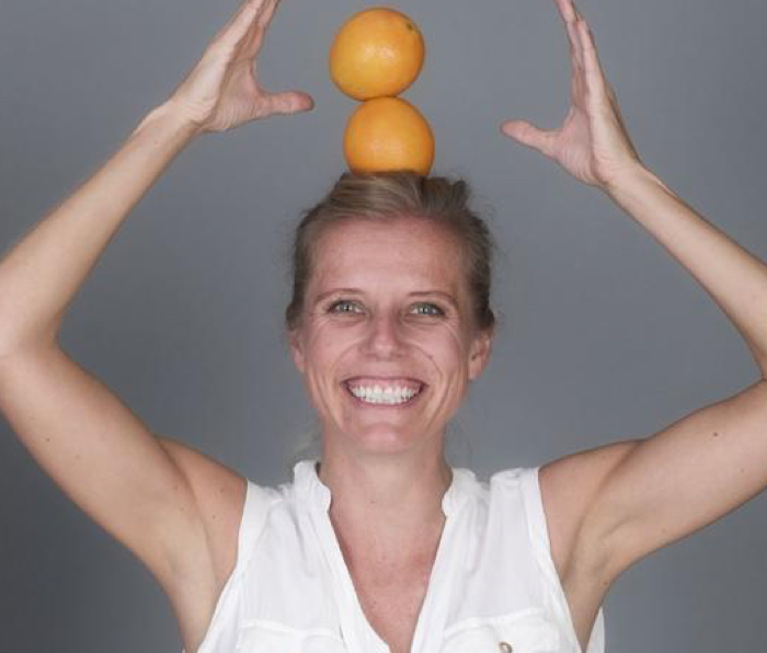 Katja Quasdorf profile image with fruit on her head